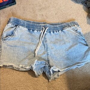 Stretchy Denim Blue Shorts with Distressed Hem